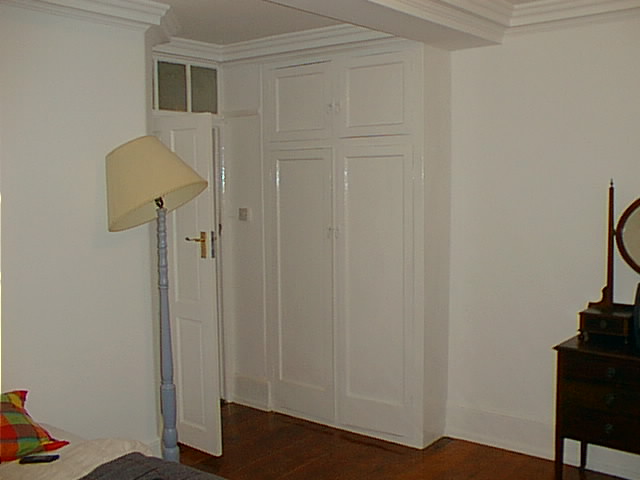 Bedroom 1 from wardrobe showing door.